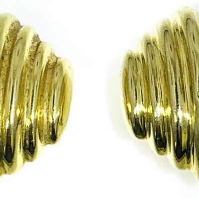 Pair of 14kt gold chip on style ribbed hollow fashion earrings. The earrings measure approx. 23.10 x 19.00mm, have omega clip on backs, a...