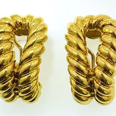 Pair of 18kt gold open double shrimp style earrings. The earrings measure approx. 27.35