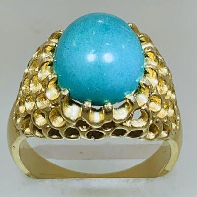 14kt gold green turquoise fashion ring. The ring features one (1), prong set, oval cabochon green turquoise set in the center of an open...