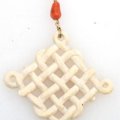 
14kt gold Kaiyin bone & coral pendant. The pendant features an interwoven piece of bone below a free form piece of coral and measures...