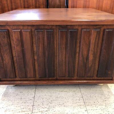 Vintage walnut storage cabinet on casters