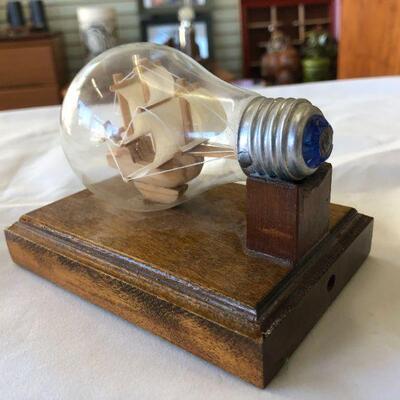 Vintage ship in a light bulb paperweight