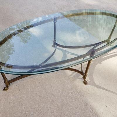 Oval Glass Coffee Table w/ Brass Frame. https://ctbids.com/#!/description/share/675681 Measures 16