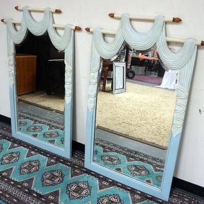 1123	PAIR OF ORNATE BEVELLED EDGE MIRRORS IN WOOD FRAMES WITH A DRAPED FABRIC STYLE MOTIF AT TOPES, 35  IN X 51 IN	100	200	50	PLEASE PAY...