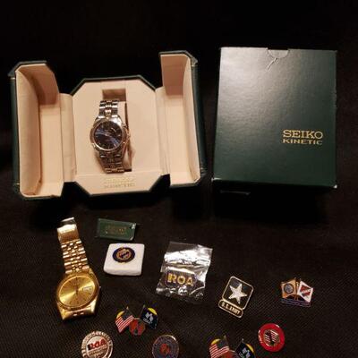 https://ctbids.com/#!/description/share/682102 Seiko Kenetic watch with box, additional Seiko watch, military related pins. See photos...