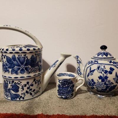 https://ctbids.com/#!/description/share/681940 Beautiful blue and white teapot, teacup, and watering can.