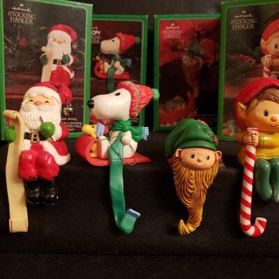https://ctbids.com/#!/description/share/687578 Adorable Vintage Hallmark Stocking Hangers Snoopy, Santa, and two adorable elves will...