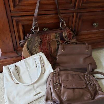 https://ctbids.com/#!/description/share/682212 White Nine West and brown Strada, Stone Mountain and Nine West purses.
