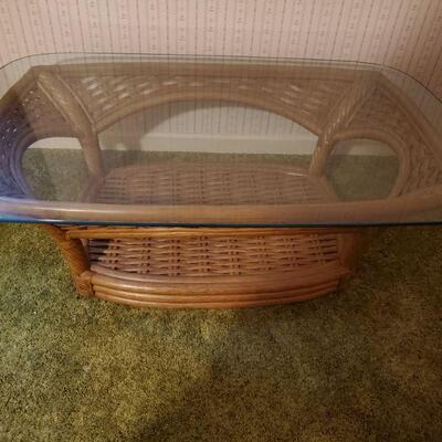 https://ctbids.com/#!/description/share/682560 Very pretty coffee table with rattan base and a tempered glass top. Top is very heavy so...