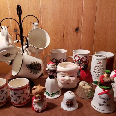 https://ctbids.com/#!/description/share/682555 Collection of Christmas mugs and bells. 