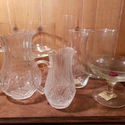 https://ctbids.com/#!/description/share/682584 Two crystal pitchers, truffle bowl, oil lamp shade, two vases and drink glass. 
