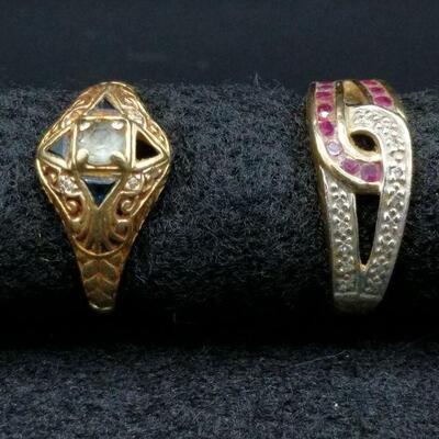 In cover photo, the ring on the left is approximatey a size 7, but difficult to tell because the band is bent. The ring on the right is a...