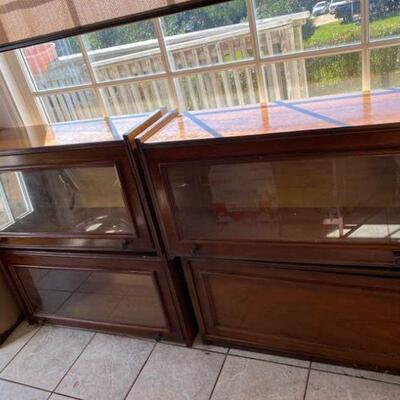 Includes 3 identical cabinets and one similar cabinet without glass. The oddball cabinet is broken or missing the pieces to hang the...