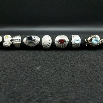 10 Silver rings approximate sizes are 7 and 7 1/2. The total weight for the lot to include stones is 2.0 oz.

 