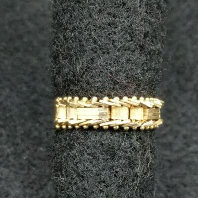 This is a 14 karat gold ring, size 7. It is a very unique ring and the fact that one side is not solid. It is more like links of a...