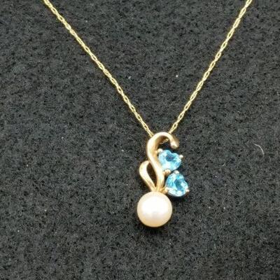 This is a gorgeous 14-karat gold pendant as well as 14 karat gold chain (20