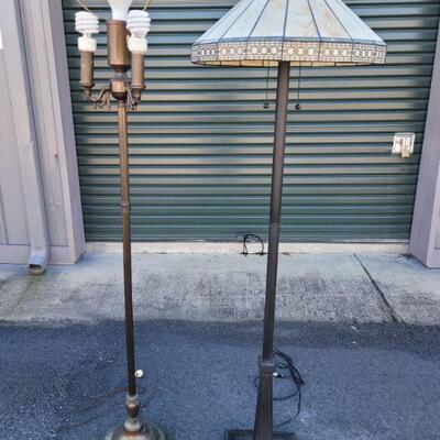 https://ctbids.com/#!/description/share/687811 One lamp has a stained glass shade and 2 pull strings to turn it on. It stands 63