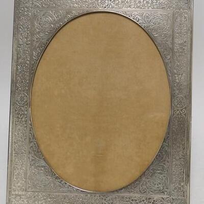 1014	FLORAL ENGRAVED SILVERPLATED FRAME 11 3/4 IN X 14 1/2 IN OPENING IS 9 IN X 11 1/2 IN 
