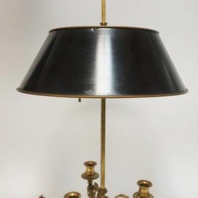 1003	BRASS LAMP W/ TIN SHADE & THREE BRASS CANDLE HOLDERS, HAS FIGURAL CHERUBS UNDER THE CANDLE CUPS. 32 IN H 
