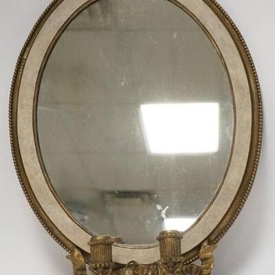 1002	OVAL MIRROR W/ TWO BRASS CANDLE HOLDERS 17 1/4 IN X 23 1/2 IN 
