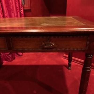 Antique desk 1920â€™s
Age appropriate leather inlaid top
2 drawers
Size
47in long
29in wide
25in high
