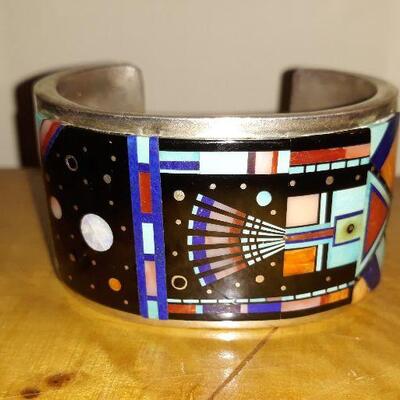 Ervin P Tsosi Sterling Mosaic Cuff Bracelet.
Navajo Signed, Ervin P Tsosi Sterling Cuff Bracelet w/ Turquoise, Coral, Sigillate, Lapis...