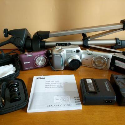 https://ctbids.com/#!/description/share/694357 A set of 4 digital cameras. Includes 3 Nikon Coolpix and Flip Video camera as well as a...