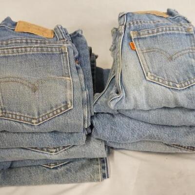 1010	LOT OF TEN YOUTH SIZED VINTAGE LEVI STRAUSS & COMPANY JEANS W/ ORANGE TABS, VARYING DEGREE OF WEAR

