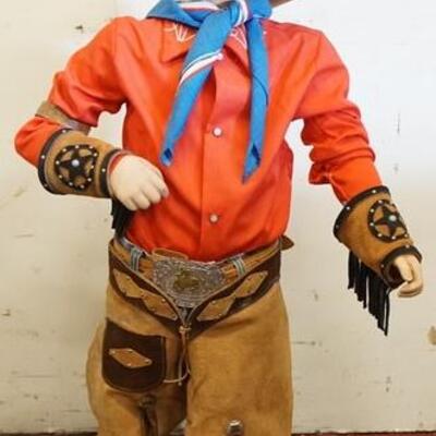 1193	YOUNG BOY MANNEQUIN CLOTHED WITH VINTAGE LEVI RED TAB JEANS, DECORATED CHAPS, DECORATED FRINGED CUFFS, LEATHER BELT WITH BUCKLE,...