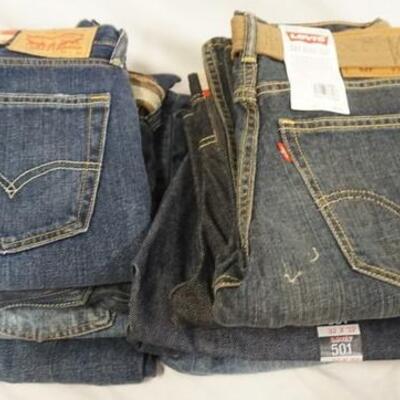 1155	LOT OF NINE PAIRS OF LEVI'S JEANS. NEW W/ TAGS. ALL HAVE 31 & 32 IN WAIST SIZES
