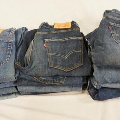 1127	LOT OF 18 PAIRS OF LEVI STRAUSS & COMPANY JEANS. ALL HAVE 31 IN WAIST. VARYING DEGREES OF WEAR 
