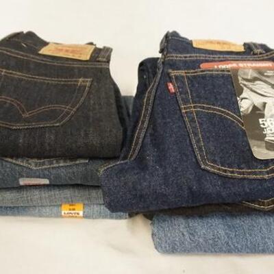 1165	LOT OF NINE PAIRS OF LEVI'S JEANS. NEW W/ TAGS SIZES 12, 10 & 8
