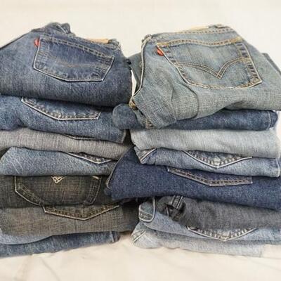 1099	LOT OF 17 PAIRS OF LEVI'S JEANS ALL ARE SIZE 12. VARYING DEGREES OF WEAR 
