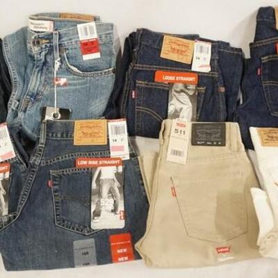 1170	LOT OF EIGHT PAIRS OF LEVI'S JEANS. NEW W/ TAGS. INCLUDING ONE USA MADE ORANGE TAB PAIR. ALL ARE SIZE 14 
