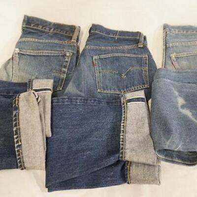 1162	LOT OF THREE PAIRS OF VINTAGE LEVI SELVEDGE JEANS W/ BIG E. VARYING DEGREES OF WEAR 
