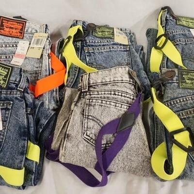 1056	LOT OF SIX PAIRS OF LEVI STRAUSS & COMPANY JEANS. ALL COME W/ SUSPENDERS. TWO ARE SIZE 12 THREE ARE SIZE 10 & ONE IS SIZE 28 X 32
