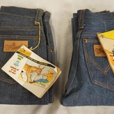 1038	LOT OF TWO PAIRS OF VINTAGE YOUTH SIZED WANGLER JEANS. ONE HAS COLORING BOOK ATTACHED, THE OTHER HAS A COMIC BOOK (COPYRIGHT DATED...