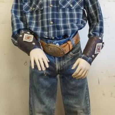 1185	YOUNG BOY MANNEQUIN CLOTHED WITH VINTAGE BIG E LEVI JEANS, BELT WITH WESTERN THEMED BUCKLE, DECORATED ARM CUFFS, WESTERN BANDANNA...