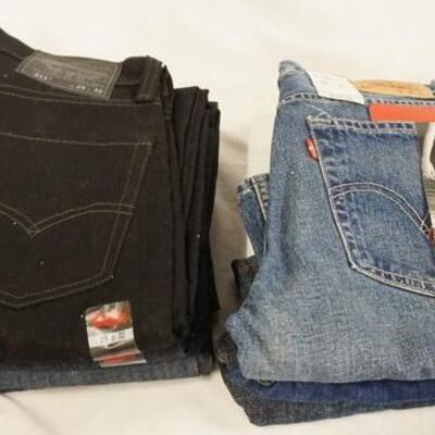 1168	LOT OF SEVEN PAIRS OF LEVI'S JEANS W/ 28 THROUGH 30 IN WAIST SIZES. NEW W/ TAGS 
