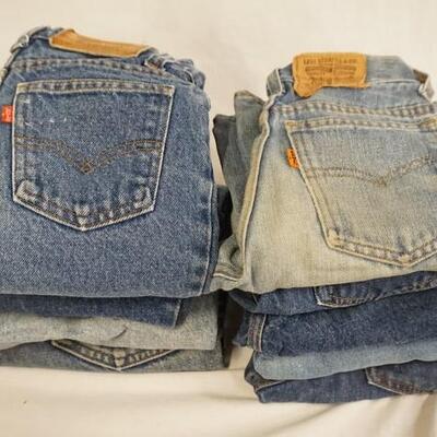 1012	LOT OF TEN PAIRS OF VINTAGE LEVI STRAUSS & COMPANY JEANS W/ RED & ORANGE TABS, VARYING DEGREE OF WEAR
