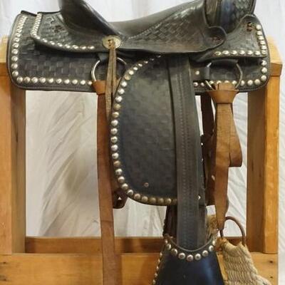 1203	WESTERN SADDLE BY SIMCO NO 1 055, MEASURES FROM HORN TO END OF SEAT APPROXIMATELY 17 IN
