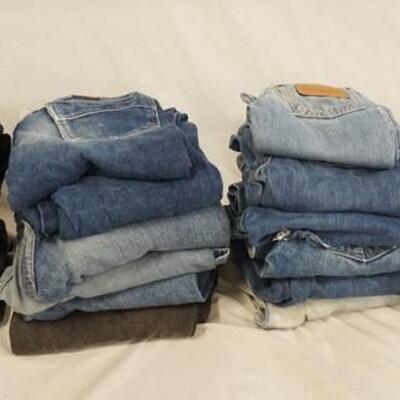 1097	LOT OF 21 PAIRS OF VINTAGE WRANGLER YOUTH SIZED JEANS. VARYING DEGREES OF WEAR 
