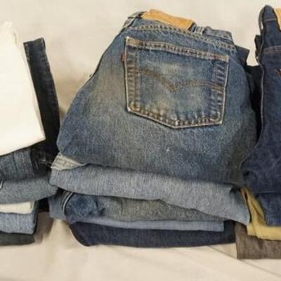 1169	LOT OF 18 PAIRS OF LEVI'S JEANS, INCLUDING FOUR W/ ORANGE TAB. ALL HAVE A 28 IN WAIST. VARYING DEGREES OF WEAR 

