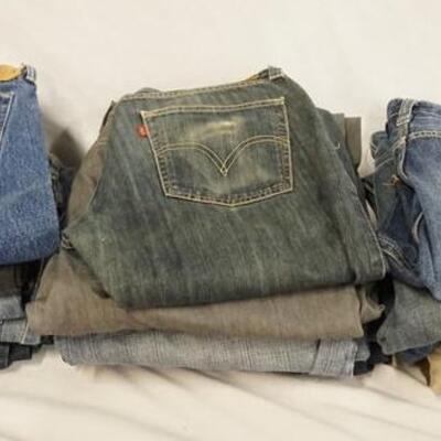 1154	LOT OF 17 PAIRS OF LEVIS JEANS. W/ 38, 40, 32 & 35 IN WAIST SIZES. VARYING DEGREES OF WEAR 
