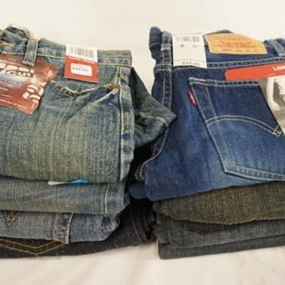 1122	LOT OF NINE PAIRS OF LEVI'S JEANS. NEW W/ TAGS. ALL ARE SIZE 8  
