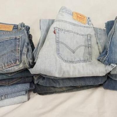 1113	LOT OF 16 PAIRS OF LEVI STRAUSS & COMPANY JEANS. ALL HAVE 28 IN WAIST. VARYING DEGREES OF WEAR
