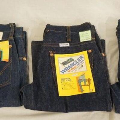 1035	LOT OF THREE PAIRS OF USA MADE VINTAGE WRANGLER JEANS W/ ORIGINAL TAGS ALL ARE SIZED 27 X 34
