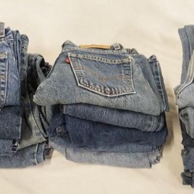 1163	LOT OF 17 PAIRS OF LEVIS JEANS. INCLUDING SIX W/ ORANGE TAB. SIZES 9 & 11. VARYING DEGREES OF WEAR 
