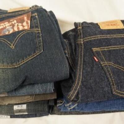 1152	LOT OF NINE PAIRS OF LEVI'S JEANS. NEW W/ TAGS W/ 26, 27, & 28 IN WAIST SIZES. 

