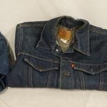 1140	LOT OF THREE VINTAGE LEVI STRAUSS & COMPANY DENIM JACKETS. ALL ARE SIZE 14. ONE HAS AN ORANGE TAB, THE OTHERS HAVE RED TABS 
